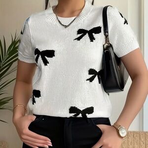 Elegant White and Black Bow Top
